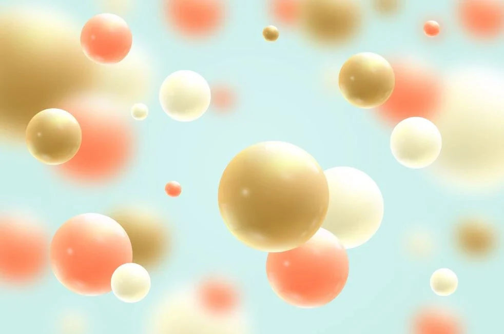 Colorful abstract rendering of fluorescent microspheres in various sizes suspended against a light background